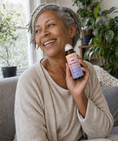 Woman holding Jovia Pure Castor Oil