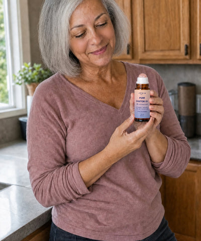 Woman holding Jovia Pure Castor Oil
