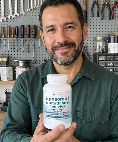 Man holding Jovia Liposomal Glutathione Complex