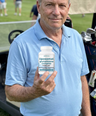 Man holding Jovia Liposomal Glutathione Complex