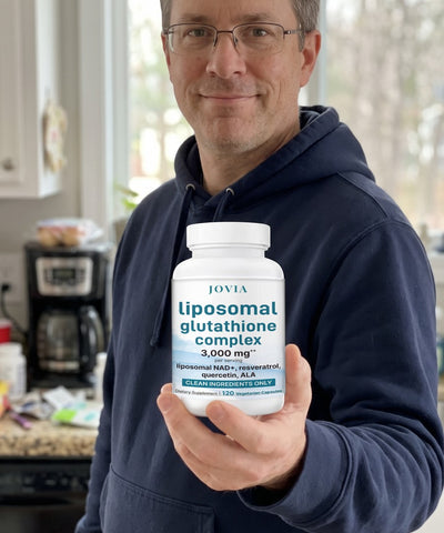 Man holding Jovia Liposomal Glutathione Complex